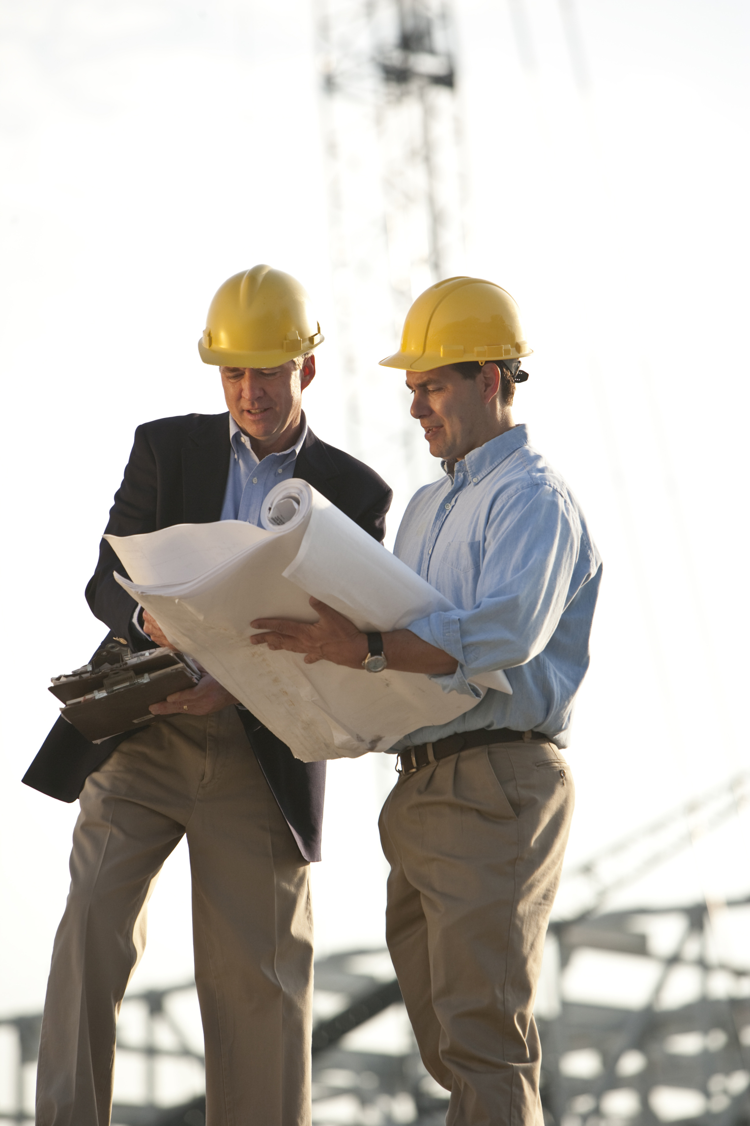 Two men discussing construction plans